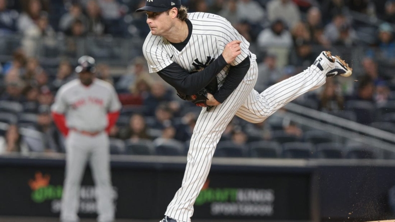 Sep 23, 2022; Bronx, New York, USA; New York Yankees starting pitcher Gerrit Cole (45) delivers a pitch during the first inning against the Boston Red Sox at Yankee Stadium. Mandatory Credit: Vincent Carchietta-USA TODAY Sports