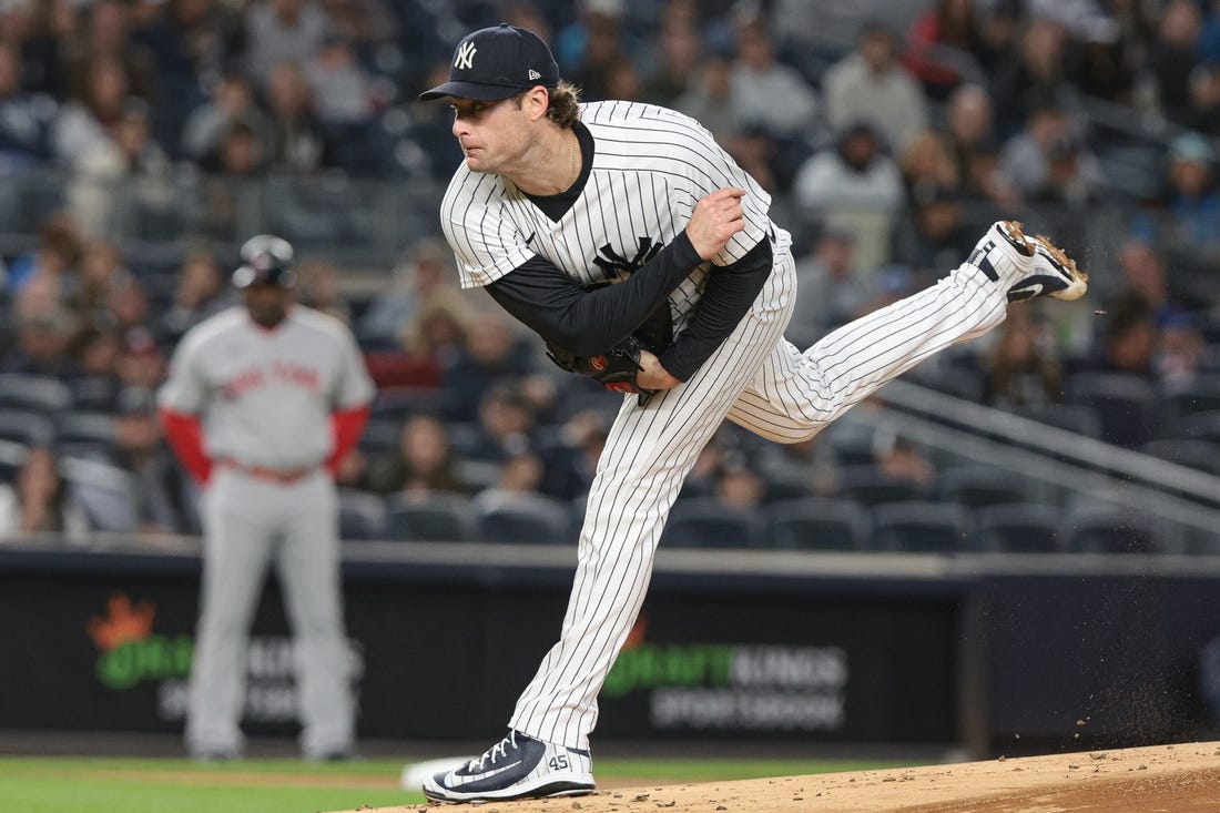 Sep 23, 2022; Bronx, New York, USA; New York Yankees starting pitcher Gerrit Cole (45) delivers a pitch during the first inning against the Boston Red Sox at Yankee Stadium. Mandatory Credit: Vincent Carchietta-USA TODAY Sports