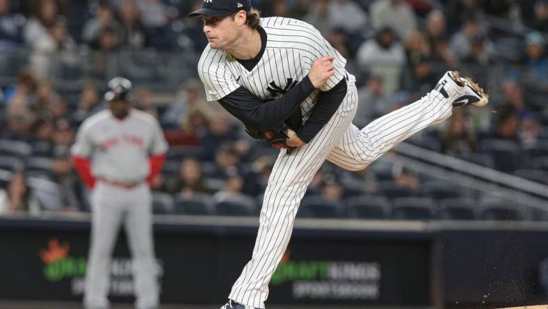 Sep 23, 2022; Bronx, New York, USA; New York Yankees starting pitcher Gerrit Cole (45) delivers a pitch during the first inning against the Boston Red Sox at Yankee Stadium. Mandatory Credit: Vincent Carchietta-USA TODAY Sports