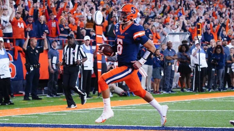 Sep 23, 2022; Syracuse, New York, USA; Syracuse Orange quarterback Garrett Shrader (6) runs with the ball for a touchdown against the Virginia Cavaliers during the first half at JMA Wireless Dome. Mandatory Credit: Gregory Fisher-USA TODAY Sports