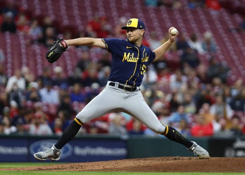 Sep 23, 2022; Cincinnati, Ohio, USA; Milwaukee Brewers starting pitcher Eric Lauer (51) throws a pitch against the Cincinnati Reds during the first inning at Great American Ball Park. Mandatory Credit: David Kohl-USA TODAY Sports