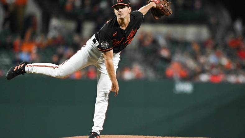 Sep 23, 2022; Baltimore, Maryland, USA;  Baltimore Orioles starting pitcher Dean Kremer (64) follows through on a first inning pitch against the Houston Astros at Oriole Park at Camden Yards. Mandatory Credit: Tommy Gilligan-USA TODAY Sports