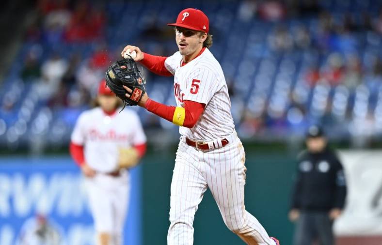 Sep 23, 2022; Philadelphia, Pennsylvania, USA; Philadelphia Phillies infielder Bryson Stott (5) throws to first against the Atlanta Braves in the ninth inning at Citizens Bank Park. Mandatory Credit: Kyle Ross-USA TODAY Sports