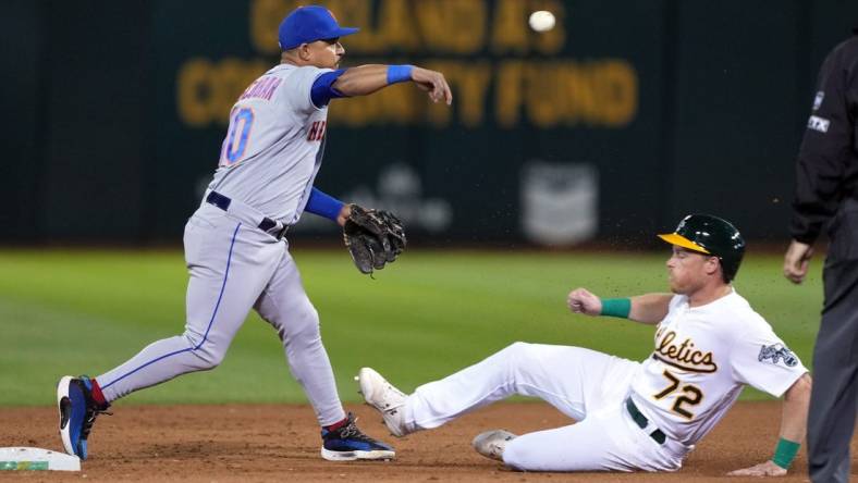 Sep 23, 2022; Oakland, California, USA; New York Mets third baseman Eduardo Escobar (10) throws the ball to first base to complete a double play after forcing out Oakland Athletics right fielder Conner Capel (72) during the fifth inning at RingCentral Coliseum. Mandatory Credit: Darren Yamashita-USA TODAY Sports