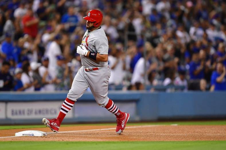Sep 23, 2022; Los Angeles, California, USA; St. Louis Cardinals designated hitter Albert Pujols (5) rounds the bases after hitting a two run home run and the 699th of his career against the Los Angeles Dodgers during the third inning at Dodger Stadium. Mandatory Credit: Gary A. Vasquez-USA TODAY Sports