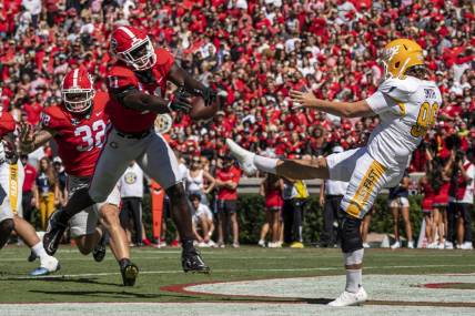 Sep 24, 2022; Athens, Georgia, USA; Georgia Bulldogs linebacker Jalon Walker (11) blocks a punt by Kent State Golden Flashes punter Josh Smith (96) for a safety during the first quarter  at Sanford Stadium. Mandatory Credit: Dale Zanine-USA TODAY Sports