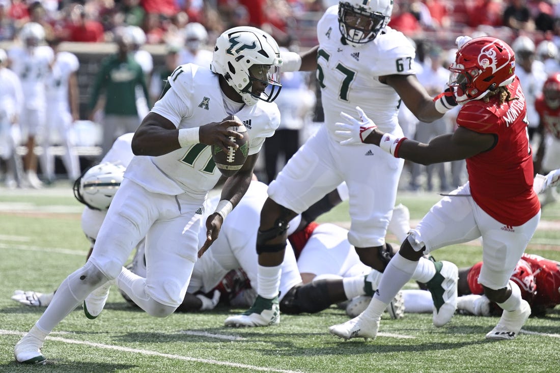 Sep 24, 2022; Louisville, Kentucky, USA; South Florida Bulls quarterback Gerry Bohanon (11) runs the ball against the Louisville Cardinals during the second quarter at Cardinal Stadium. Mandatory Credit: Jamie Rhodes-USA TODAY Sports