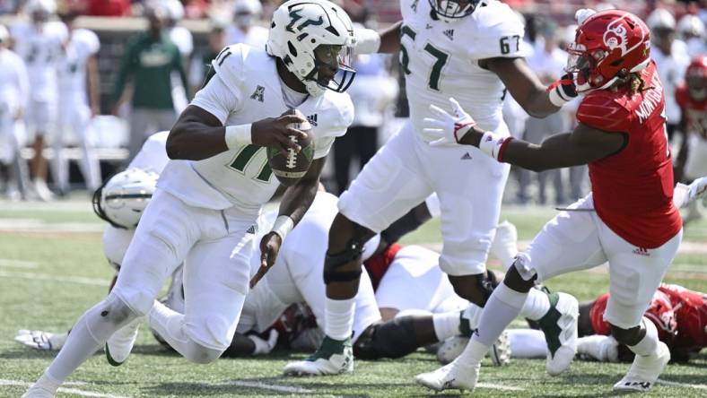 Sep 24, 2022; Louisville, Kentucky, USA; South Florida Bulls quarterback Gerry Bohanon (11) runs the ball against the Louisville Cardinals during the second quarter at Cardinal Stadium. Mandatory Credit: Jamie Rhodes-USA TODAY Sports