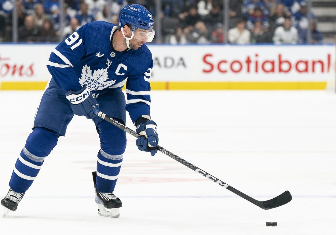 Sep 24, 2022; Toronto, Ontario, CAN; Toronto Maple Leafs center John Tavares (91) skates with the puck against the Ottawa Senators during the third period at Scotiabank Arena. Mandatory Credit: Nick Turchiaro-USA TODAY Sports