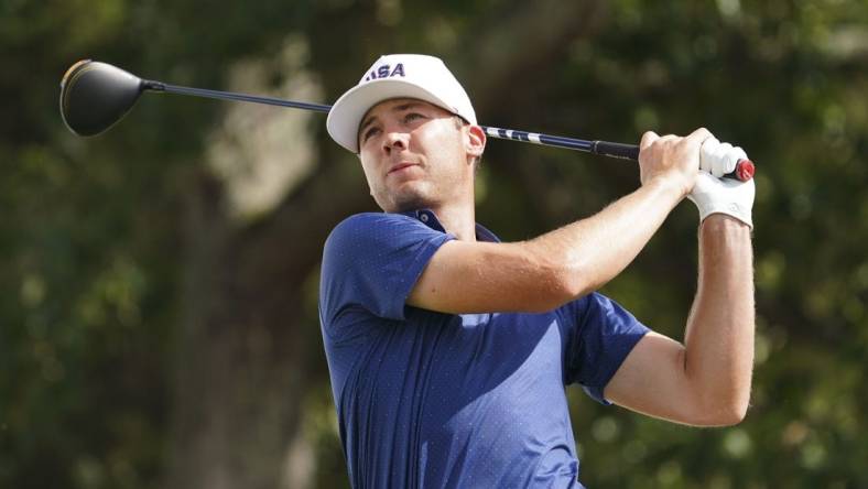 Sep 24, 2022; Charlotte, North Carolina, USA; Team USA golfer Sam Burns hits his tee shot on the 12th hole during the four-ball match play of the Presidents Cup golf tournament at Quail Hollow Club. Mandatory Credit: Peter Casey-USA TODAY Sports