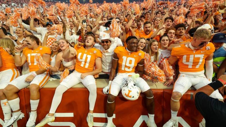 Sep 24, 2022; Knoxville, Tennessee, USA; Tennessee Volunteers players celebrate with fans after the game against the Florida Gators at Neyland Stadium. Mandatory Credit: Randy Sartin-USA TODAY Sports