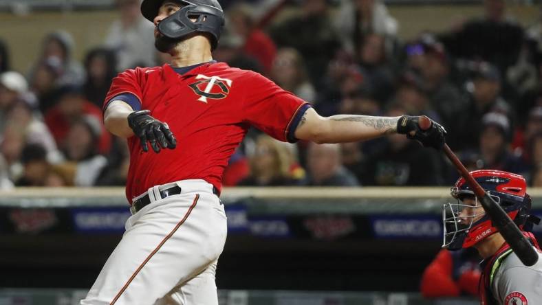 Sep 24, 2022; Minneapolis, Minnesota, USA; Minnesota Twins catcher Gary Sanchez (24) hits a three-run home run against the Los Angeles Angels in the fifth inning at Target Field. Mandatory Credit: Bruce Kluckhohn-USA TODAY Sports