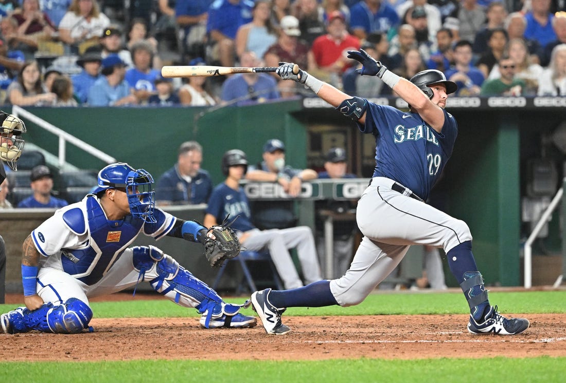 Sep 24, 2022; Kansas City, Missouri, USA;  Seattle Mariners pinch hitter Cal Raleigh (29) hits a two-run home run during the sixth inning against the Kansas City Royals at Kauffman Stadium. Mandatory Credit: Peter Aiken-USA TODAY Sports