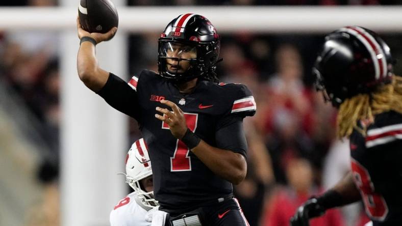 Sep 24, 2022; Columbus, Ohio, USA; Ohio State Buckeyes quarterback C.J. Stroud (7) throws during the second half of the NCAA Division I football game against the Wisconsin Badgers at Ohio Stadium. Ohio State won 52-21. Mandatory Credit: Adam Cairns-The Columbus Dispatch

Ncaa Football Wisconsin Badgers At Ohio State Buckeyes