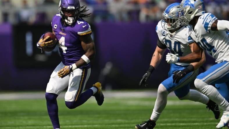 Sep 25, 2022; Minneapolis, Minnesota, USA; Minnesota Vikings running back Dalvin Cook (4) runs the ball as Detroit Lions linebacker Alex Anzalone (34) and cornerback Amani Oruwariye (24) pursue during the first quarter at U.S. Bank Stadium. Mandatory Credit: Jeffrey Becker-USA TODAY Sports