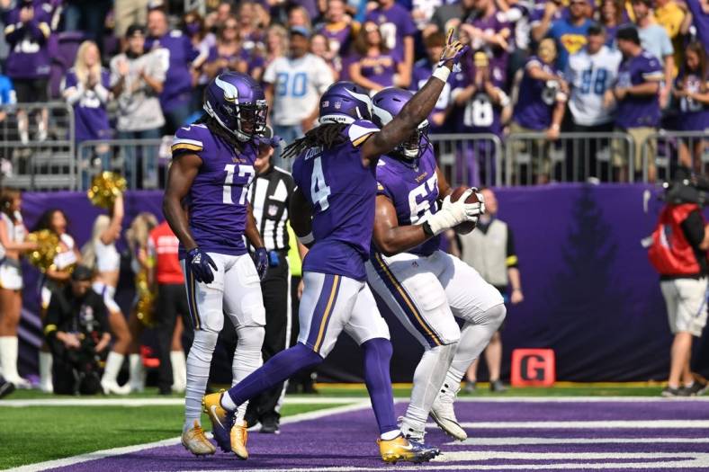 Sep 25, 2022; Minneapolis, Minnesota, USA; Minnesota Vikings running back Dalvin Cook (4) and wide receiver K.J. Osborn (17) and guard Ed Ingram (67) react after a touchdown against the Detroit Lions during the second quarter at U.S. Bank Stadium. Mandatory Credit: Jeffrey Becker-USA TODAY Sports