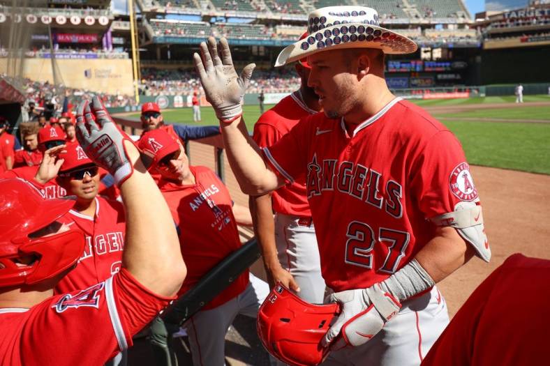 Sep 25, 2022; Minneapolis, Minnesota, USA; Los Angeles Angels center fielder Mike Trout (27) celebrates a solo home run against the Minnesota Twins in the third inning at Target Field. Mandatory Credit: Matt Krohn-USA TODAY Sports