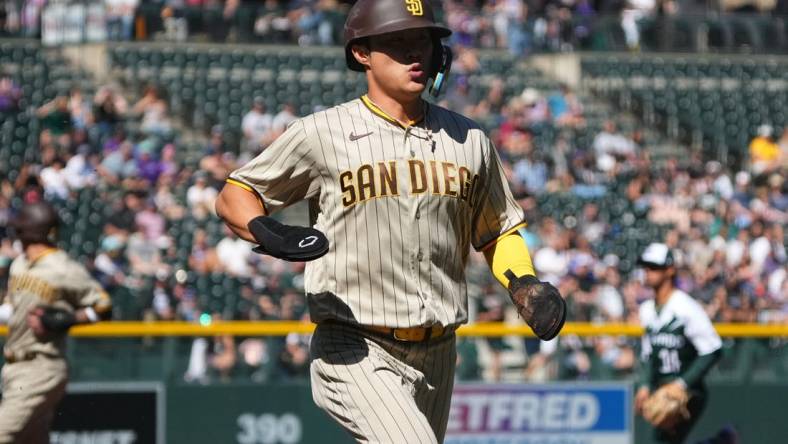 Sep 25, 2022; Denver, Colorado, USA; San Diego Padres shortstop Ha-Seong Kim (7) scores a run in the first inning against the Colorado Rockies at Coors Field. Mandatory Credit: Ron Chenoy-USA TODAY Sports