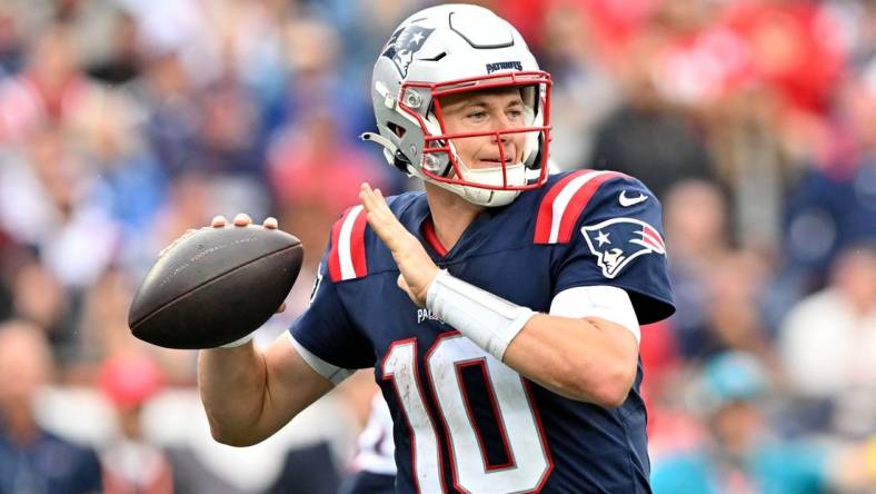 Sep 25, 2022; Foxborough, Massachusetts, USA; New England Patriots quarterback Mac Jones (10) throws the ball against the Baltimore Ravens during the second half at Gillette Stadium. Mandatory Credit: Brian Fluharty-USA TODAY Sports