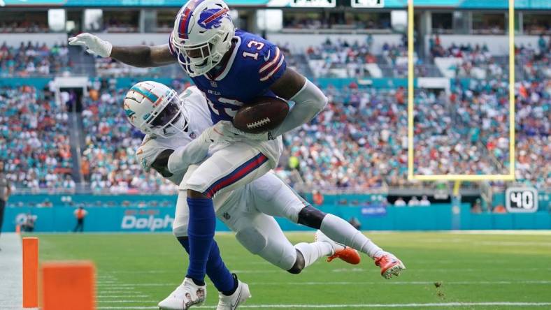 Sep 25, 2022; Miami Gardens, Florida, USA; Miami Dolphins cornerback Keion Crossen (27) breaks up the pass intended for Buffalo Bills wide receiver Gabe Davis (13) during the second half at Hard Rock Stadium. Mandatory Credit: Jasen Vinlove-USA TODAY Sports