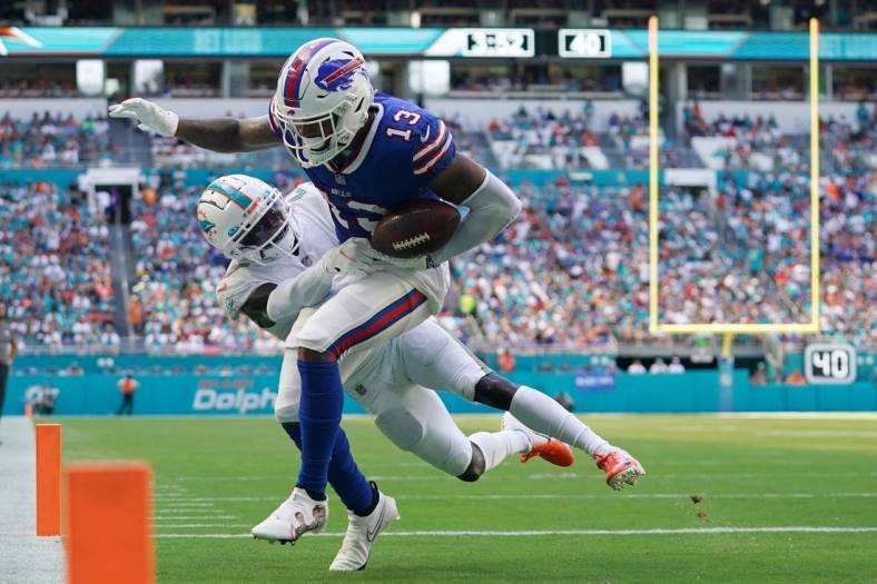Sep 25, 2022; Miami Gardens, Florida, USA; Miami Dolphins cornerback Keion Crossen (27) breaks up the pass intended for Buffalo Bills wide receiver Gabe Davis (13) during the second half at Hard Rock Stadium. Mandatory Credit: Jasen Vinlove-USA TODAY Sports
