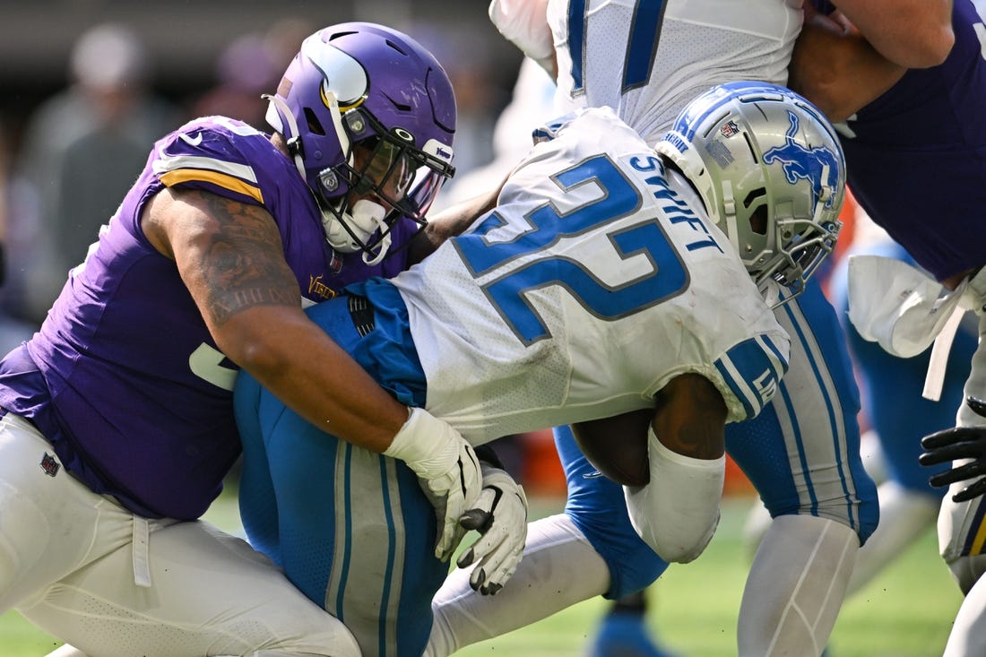 Sep 25, 2022; Minneapolis, Minnesota, USA; Detroit Lions running back D'Andre Swift (32) is tackled by Minnesota Vikings defensive end Jonathan Bullard (93) during the fourth quarter at U.S. Bank Stadium. Mandatory Credit: Jeffrey Becker-USA TODAY Sports