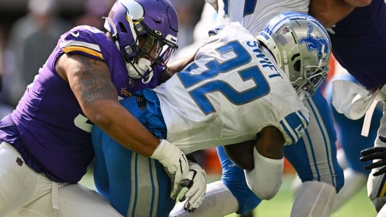 Sep 25, 2022; Minneapolis, Minnesota, USA; Detroit Lions running back D'Andre Swift (32) is tackled by Minnesota Vikings defensive end Jonathan Bullard (93) during the fourth quarter at U.S. Bank Stadium. Mandatory Credit: Jeffrey Becker-USA TODAY Sports