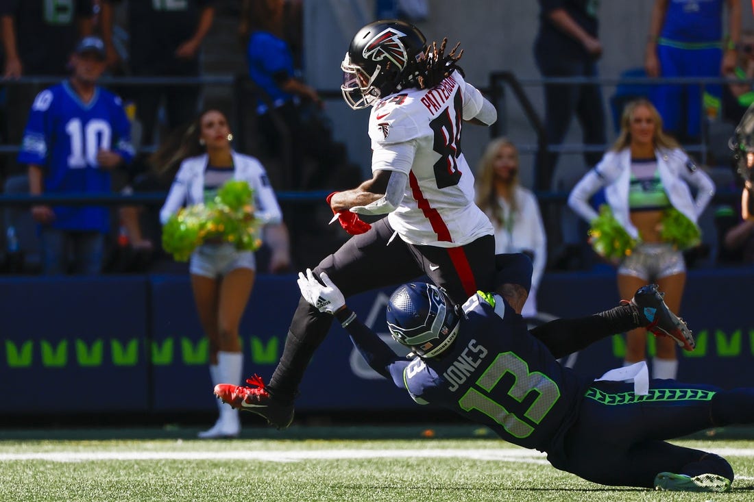 Sep 25, 2022; Seattle, Washington, USA; Atlanta Falcons running back Cordarrelle Patterson (84) breaks a tackle attempt to rush for a touchdown against the Seattle Seahawks during the second quarter at Lumen Field. Mandatory Credit: Joe Nicholson-USA TODAY Sports