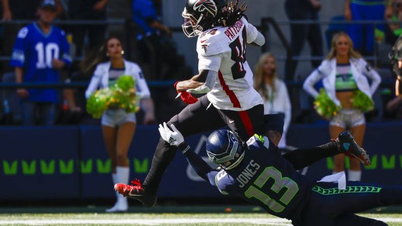 Sep 25, 2022; Seattle, Washington, USA; Atlanta Falcons running back Cordarrelle Patterson (84) breaks a tackle attempt to rush for a touchdown against the Seattle Seahawks during the second quarter at Lumen Field. Mandatory Credit: Joe Nicholson-USA TODAY Sports