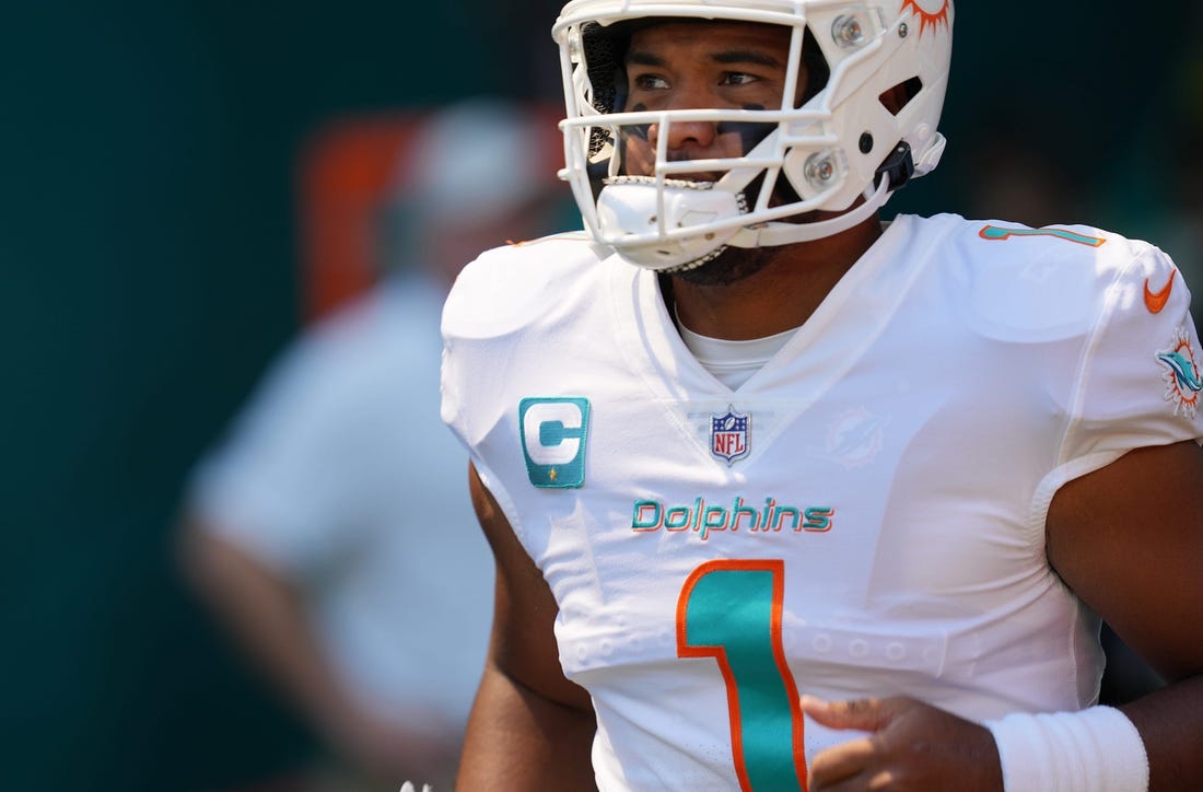 Miami Dolphins quarterback Tua Tagovailoa takes the field for warm-ups before the game against the Buffalo Bills at Hard Rock Stadium in Miami Gardens, Sept. 25, 2022.