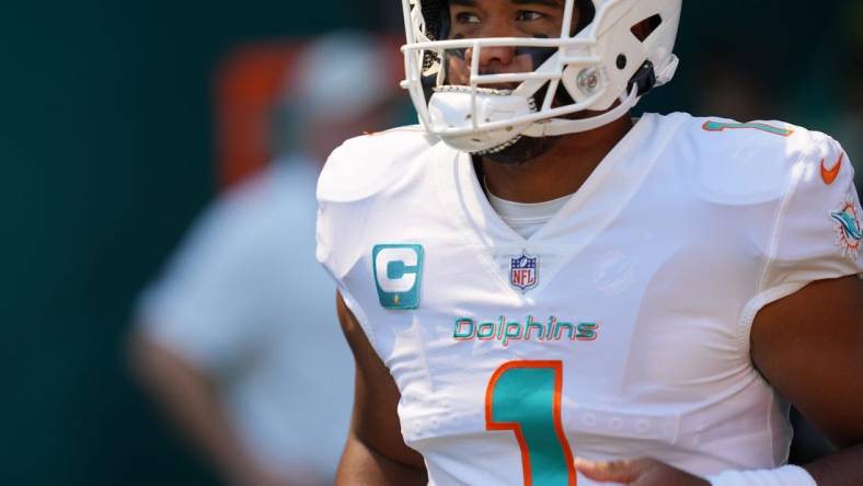 Miami Dolphins quarterback Tua Tagovailoa takes the field for warm-ups before the game against the Buffalo Bills at Hard Rock Stadium in Miami Gardens, Sept. 25, 2022.