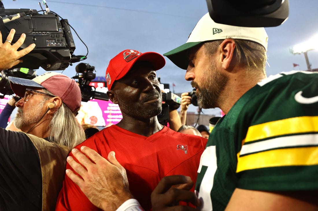 Sep 25, 2022; Tampa, Florida, USA; Tampa Bay Buccaneers head coach Todd Bowles and Green Bay Packers quarterback Aaron Rodgers (12) greet after the game at Raymond James Stadium. Mandatory Credit: Kim Klement-USA TODAY Sports