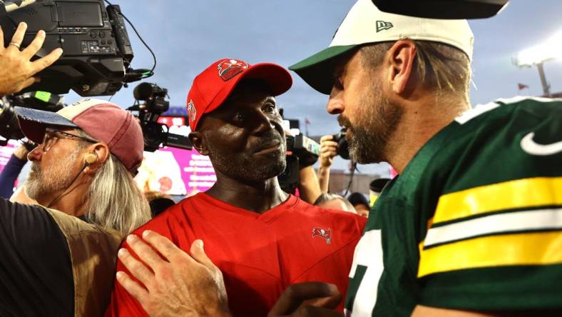 Sep 25, 2022; Tampa, Florida, USA; Tampa Bay Buccaneers head coach Todd Bowles and Green Bay Packers quarterback Aaron Rodgers (12) greet after the game at Raymond James Stadium. Mandatory Credit: Kim Klement-USA TODAY Sports