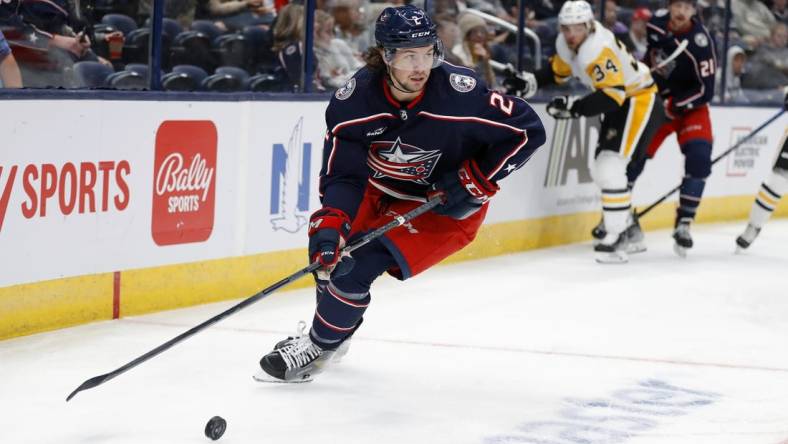 Sep 25, 2022; Columbus, Ohio, USA; Columbus Blue Jackets defenseman Andrew Peeke (2) looks to pass the puck during the first period against the Pittsburgh Penguins at Nationwide Arena. Mandatory Credit: Joseph Maiorana-USA TODAY Sports