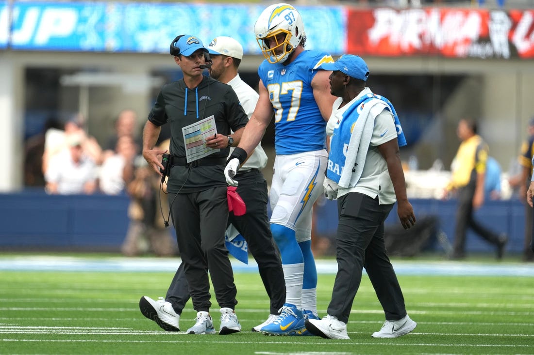 Sep 25, 2022; Inglewood, California, USA; Los Angeles Chargers linebacker Joey Bosa (97) walks off the field with Brandon Staley after suffering an injury against the Jacksonville Jaguars in the first half at SoFi Stadium. Mandatory Credit: Kirby Lee-USA TODAY Sports