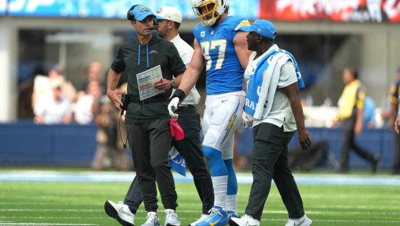 Sep 25, 2022; Inglewood, California, USA; Los Angeles Chargers linebacker Joey Bosa (97) walks off the field with Brandon Staley after suffering an injury against the Jacksonville Jaguars in the first half at SoFi Stadium. Mandatory Credit: Kirby Lee-USA TODAY Sports