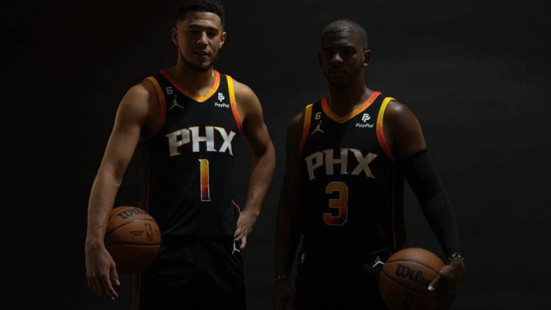 Sep 26, 2022; Phoenix, AZ, USA; Phoenix Suns guard Devin Booker (1) and Phoenix Suns guard Chris Paul (3) pose for a photo during Suns Media Day at Events on Jackson Mandatory Credit: Joe Camporeale-USA TODAY Sports