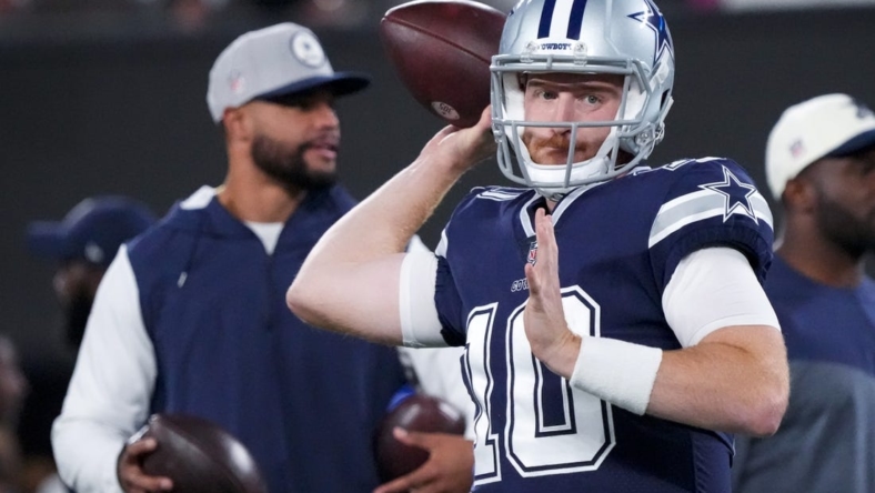 Sep 26, 2022; East Rutherford, New Jersey, USA;  Dallas Cowboys quarterback Cooper Rush (10) warms up in front of quarterback Dak Prescott before the game against the New York Giants at MetLife Stadium. Mandatory Credit: Robert Deutsch-USA TODAY Sports