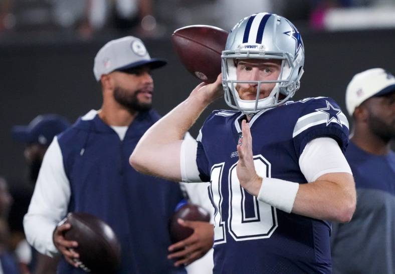 Sep 26, 2022; East Rutherford, New Jersey, USA;  Dallas Cowboys quarterback Cooper Rush (10) warms up in front of quarterback Dak Prescott before the game against the New York Giants at MetLife Stadium. Mandatory Credit: Robert Deutsch-USA TODAY Sports