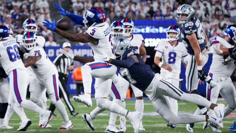 Sep 26, 2022; East Rutherford, NJ, USA;  Dallas Cowboys cornerback Trevon Diggs (7) defends the pass intended for New York Giants wide receiver Sterling Shepard (3) during the first quarter at MetLife Stadium. Mandatory Credit: Robert Deutsch-USA TODAY Sports