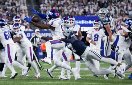 Sep 26, 2022; East Rutherford, NJ, USA;  Dallas Cowboys cornerback Trevon Diggs (7) defends the pass intended for New York Giants wide receiver Sterling Shepard (3) during the first quarter at MetLife Stadium. Mandatory Credit: Robert Deutsch-USA TODAY Sports