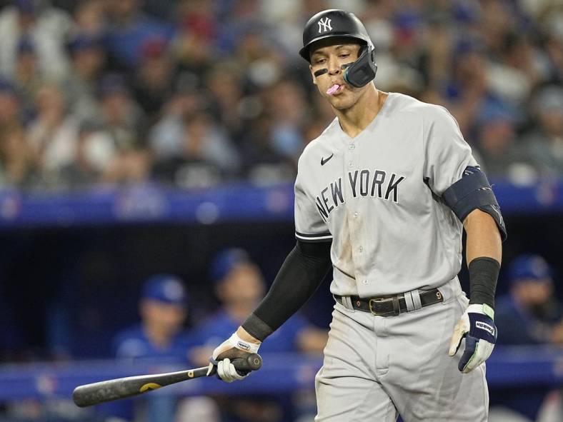 Sep 26, 2022; Toronto, Ontario, CAN; New York Yankees right fielder Aaron Judge (99) spits out his gum after striking out against the Toronto Blue Jays during the sixth inning at Rogers Centre. Mandatory Credit: John E. Sokolowski-USA TODAY Sports