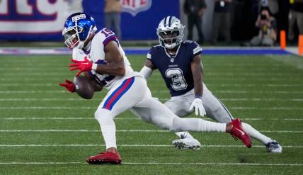 Sep 26, 2022; East Rutherford, NJ, USA;  New York Giants wide receiver Kenny Golladay (19) tries to catch the ball as Dallas Cowboys cornerback Anthony Brown (3) defends during the second half at MetLife Stadium. Mandatory Credit: Robert Deutsch-USA TODAY Sports