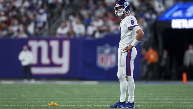 Sep 26, 2022; East Rutherford, New Jersey, USA;  New York Giants quarterback Daniel Jones (8) reacts to an intentional grounding penalty flag during the second half against the Dallas Cowboys at MetLife Stadium. Mandatory Credit: Brad Penner-USA TODAY Sports