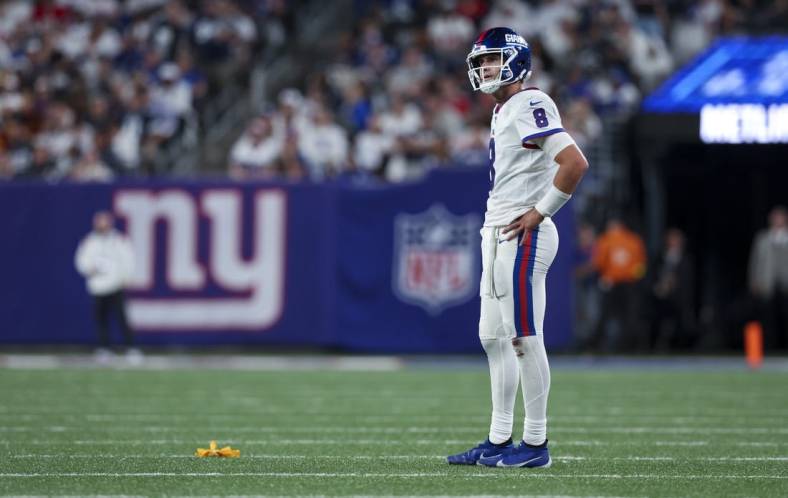 Sep 26, 2022; East Rutherford, New Jersey, USA;  New York Giants quarterback Daniel Jones (8) reacts to an intentional grounding penalty flag during the second half against the Dallas Cowboys at MetLife Stadium. Mandatory Credit: Brad Penner-USA TODAY Sports