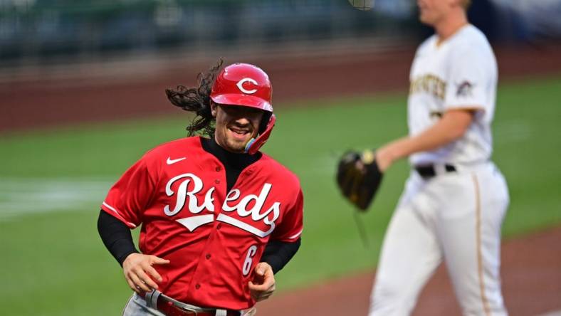 Sep 27, 2022; Pittsburgh, Pennsylvania, USA; Cincinnati Reds second baseman Jonathan India (6) scores a run after a wild pitch by Pittsburgh Pirates starting pitcher Mitch Keller (23) during the first inning at PNC Park. Mandatory Credit: David Dermer-USA TODAY Sports