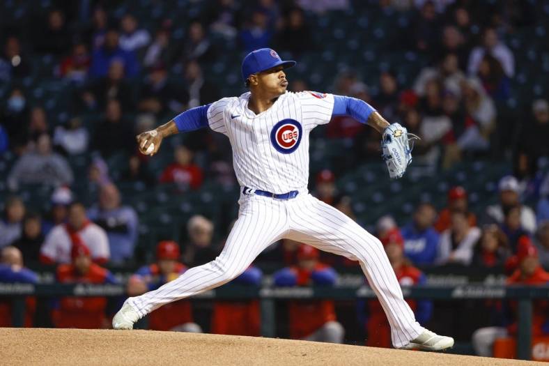 Sep 27, 2022; Chicago, Illinois, USA; Chicago Cubs starting pitcher Marcus Stroman (0) delivers against the Philadelphia Phillies during the first inning at Wrigley Field. Mandatory Credit: Kamil Krzaczynski-USA TODAY Sports