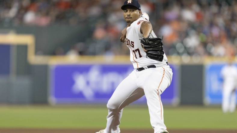 Sep 27, 2022; Houston, Texas, USA; Houston Astros starting pitcher Luis Garcia (77) pitches against the Arizona Diamondbacks in the second inning at Minute Maid Park. Mandatory Credit: Thomas Shea-USA TODAY Sports