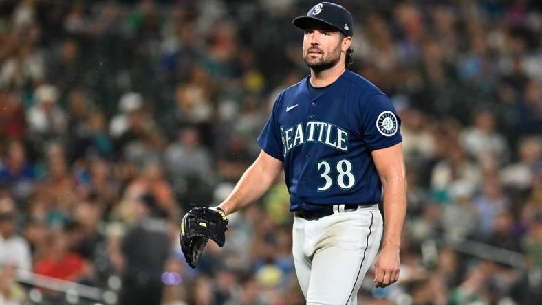 Sep 27, 2022; Seattle, Washington, USA; Seattle Mariners starting pitcher Robbie Ray (38) walks off the field after striking out Texas Rangers left fielder Bubba Thompson (65) (not pictured) to end the top of the fifth inning at T-Mobile Park. Mandatory Credit: Steven Bisig-USA TODAY Sports