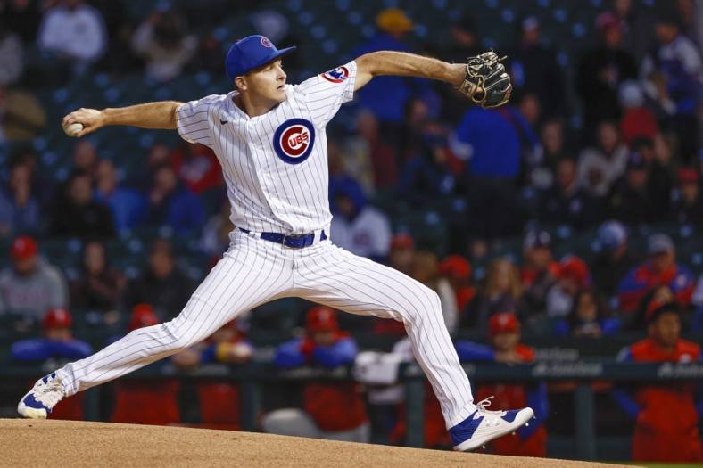Sep 28, 2022; Chicago, Illinois, USA; Chicago Cubs starting pitcher Hayden Wesneski (19) delivers against the Philadelphia Phillies during the first inning at Wrigley Field. Mandatory Credit: Kamil Krzaczynski-USA TODAY Sports